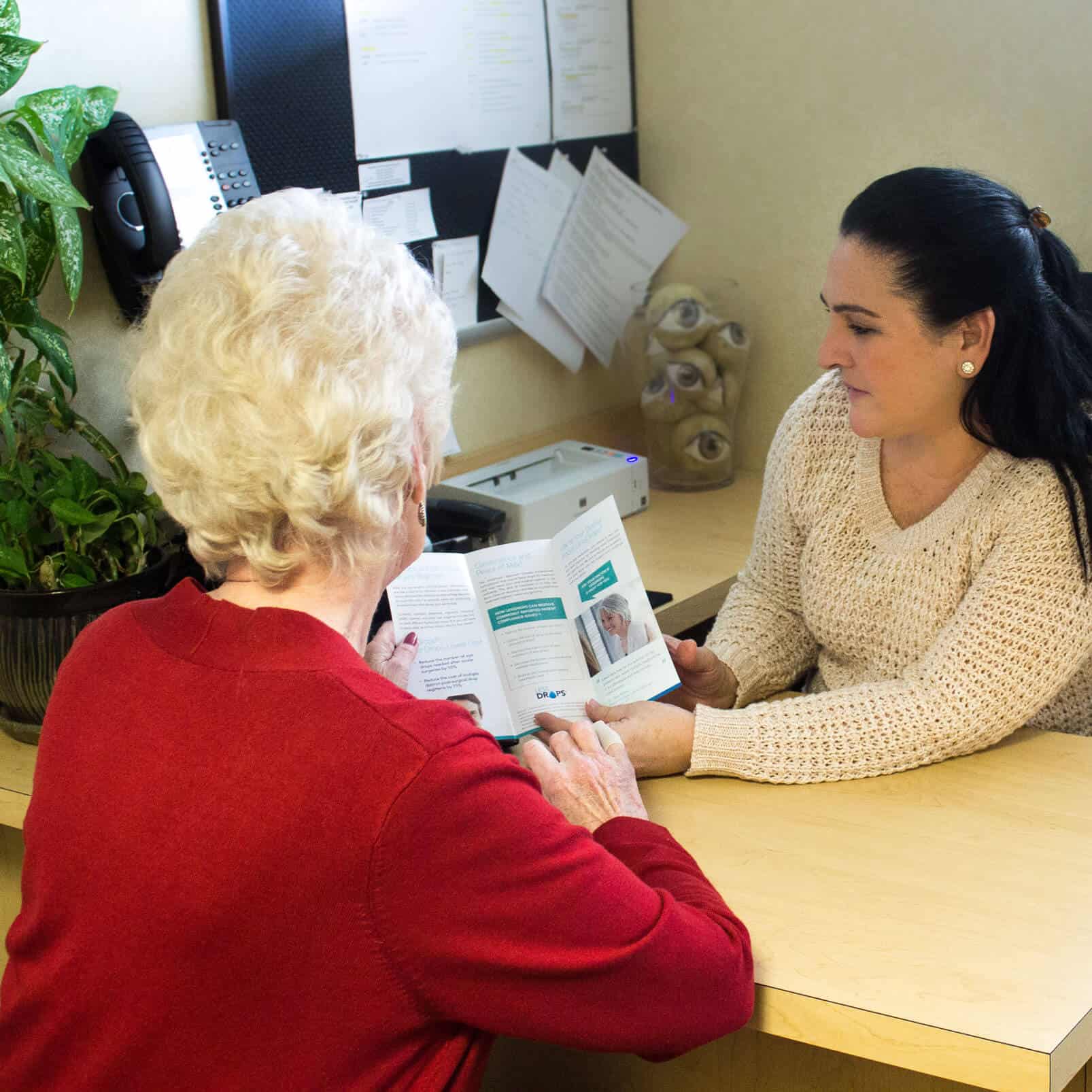 Patient reviewing a cataract pamphlet to decide which of the many procedures offered at Bucks-Mont Eye will be best for her.