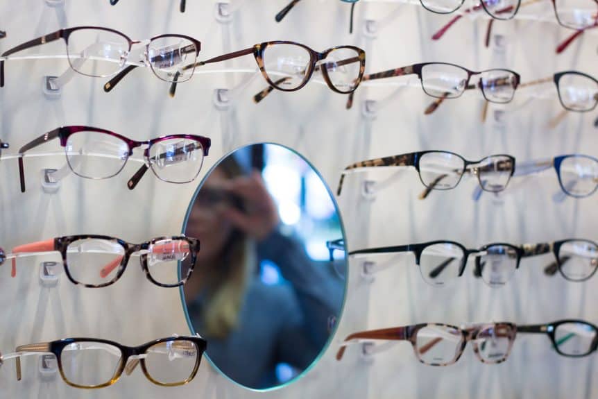 Individual trying on new eyeglasses at Pennridge Opticians